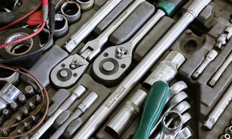 Silver and Green Screw Driver
